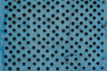 Metal surface with round seven-dimensional holes