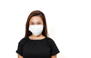 Asian lady wearing face mask for protection against coronavirus in white background with space for...