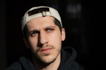 portrait of young man with the  sunlight on his face 