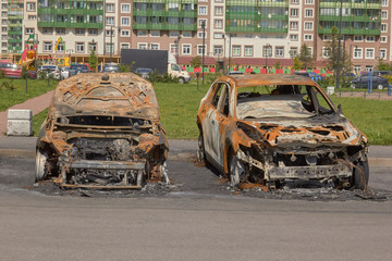 city burned cars after a fire in one of the city's districts