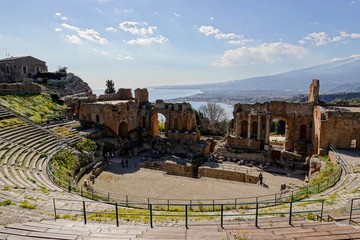 Teatro Antico di Taormina (Ancient Amphitheatre) in Sicily, Italy during sunny day with sea in the...