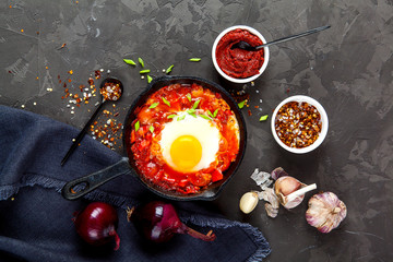 Shakshuka Scrambled eggs with tomatoes and vegetables. Breakfast. In the plate. Top view. Flat lay composition Free copy space.