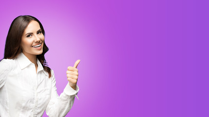 Portrait of happy smiling young excited businesswoman, showing thumb up hand sign gesture. Success...