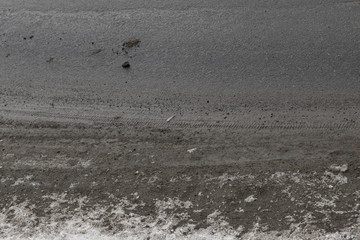 top view of the road and melted the snow on the sidewalk. The arrival of spring