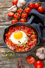 Shakshuka Scrambled eggs with tomatoes and vegetables. Breakfast. In the plate. Top view. Flat lay composition Free copy space.
