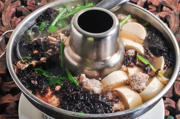 Clear Soup with Tofu and Minced Pork in a Stainless Steel Hot Pot