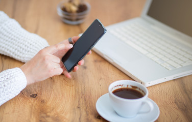 Close up of a woman using mobile smart phone