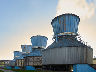 Industrial landscape with view of several ball gasholders with lightning protection and safety...