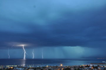 Naklejka na ściany i meble Storm over the sea. Thunderstorm over Adriatic Sea. Lightening bolt.
