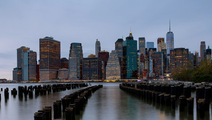 Fototapeta na wymiar Panorama of beautiful sence of New York city with lower Manhattan in dusk evening. Downtown of lower Manhattan of Hudson river
