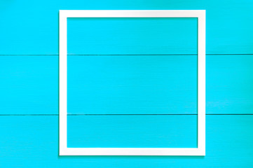 wooden frame on a blue background. blank photo frame isolate.