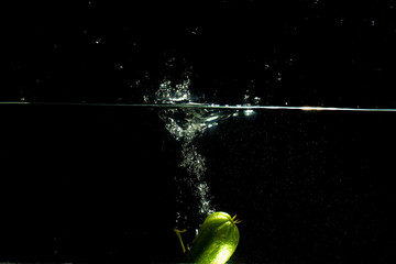 fresh starfruit water splash with black background
