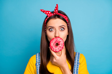 Close-up portrait of her she nice attractive lovely glamorous cheerful funky comic girl closing mouth with macaron isolated on bright vivid shine vibrant blue green teal turquoise color background