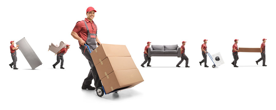 Male worker pushing a hand-truck and other workers carrying furniture