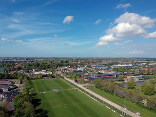 Fototapeta na wymiar Drone Aerial view of of soccer fields and the buildings of the village of Grootebroek, which is part of urban planning. Photo make with a drone