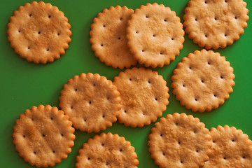 round crackers on a green background