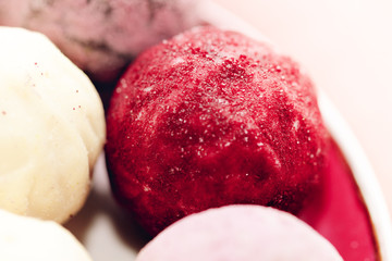 Delicious chocolate pralines. Close up Horizontal View of Homemade Vegan Paleo Chocolate Truffles, Luxury Healthy Dessert, Velvety Red Smooth Chocolate Truffles