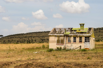 Fototapeta na wymiar Abandoned House In The Savannah Of Masai Mara Park