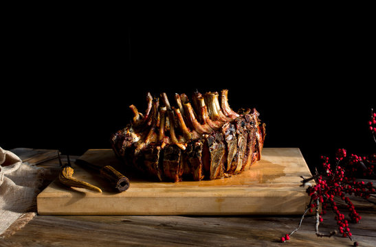 Crown Roast Of Pork On Wooden Cutting Board