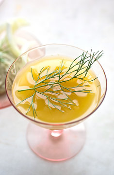 Yellow cocktail with dill