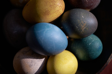 Fototapeta na wymiar Easter. Naturally colored eggs background. Selective focus.