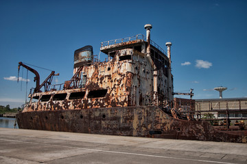 Fototapeta na wymiar old, rusty ship abandoned on the shore.