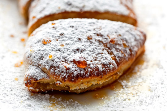 Close up of cannoli&dagger;cream&dagger;calzone&dagger;with honey and orange