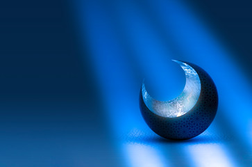 Crescent moon decorated with arabesque pattern with moon light effect.
