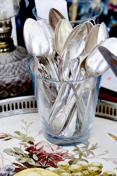 Close up of spoons in glass cup