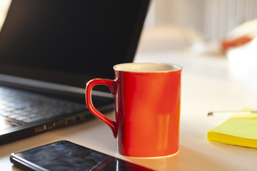 Smartworking set to work in quarantine from home with laptop, mobile and block notes

