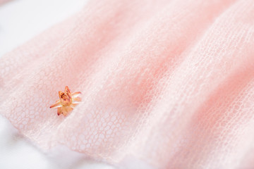 fluffy, knitted peach color texture