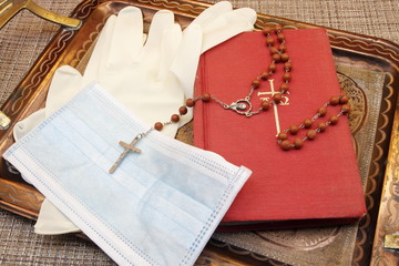 Commodities to be used to prevent the spread of Coronavirus, asking for divine help, tray with...