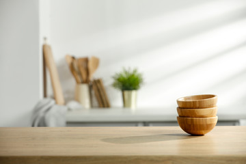 Table background of free space and kitchen interior with white wall and shadows.Copy space for your composition. 