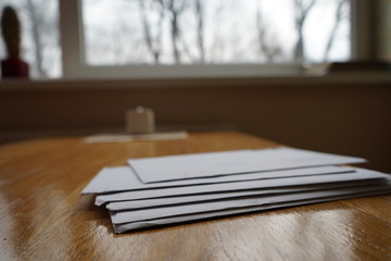 A stack of envelopes on the table