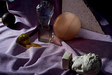 Close up of busts and spheres on fabric