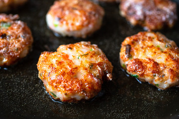 Vietnamese style crispy shrimp cakes being fried