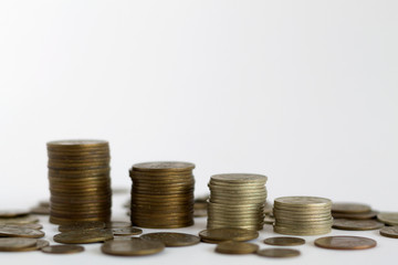 stack of coins on the white table. copy space. finance. payment of bills