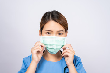 Portrait of young asian nurse wearing surgical mask