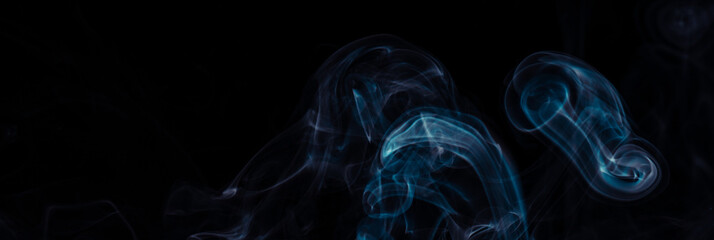 Blue smoke on black background