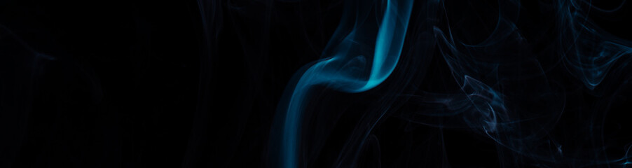 Blue smoke on black background