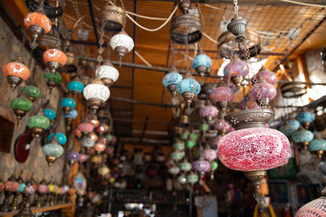 Vintage colourful Turkish lamps on the market roof.
