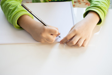 Child boyDrawing With Colourful Pencils