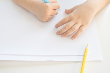 Child boyDrawing With Colourful Pencils