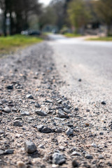 Country gravel road with trees 