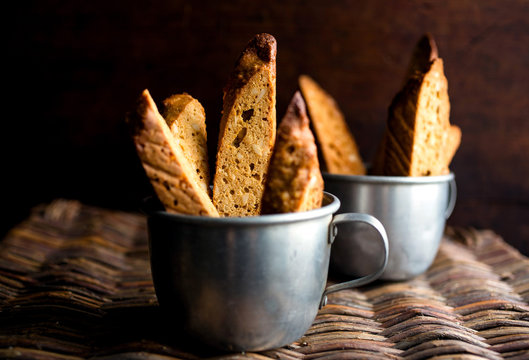 Gluten free Hazelnut, orange and honey biscotti in metal cups