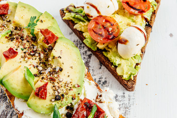 bruschettas with avocado and avocado with egg healthy breakfast