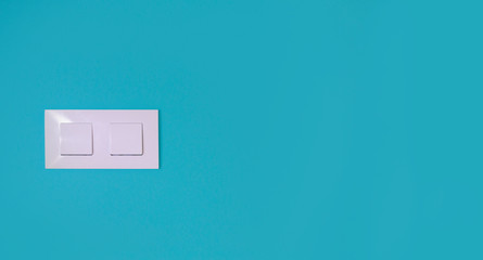 Light switch on a blue wall