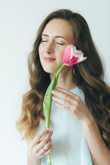 Beautiful girl hugging tulip, girl and tulip