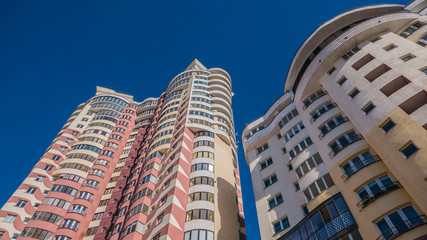 Fototapeta na wymiar high-rise apartment building with a multi-colored facade