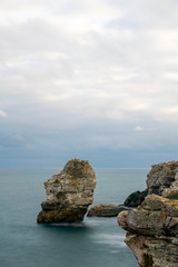Long expoure image of the coastal cliffs of  Tiulenovo resort in Bulgaria. Fine art vertical...